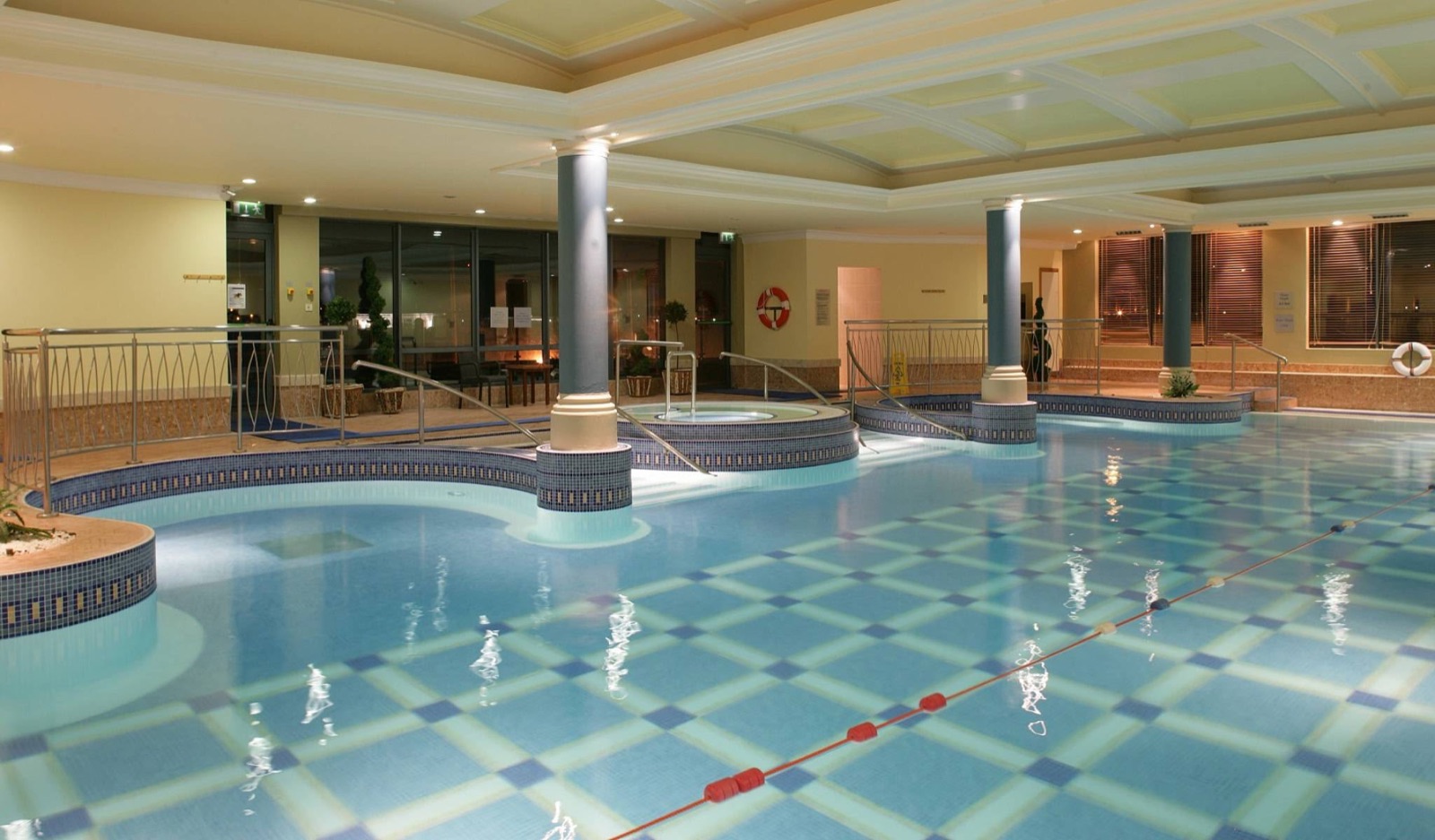 Leisure-centre pool at The Galmount Hotel — mosaic-tiled deck, steps and hot tub surround kept clean and slip-safe